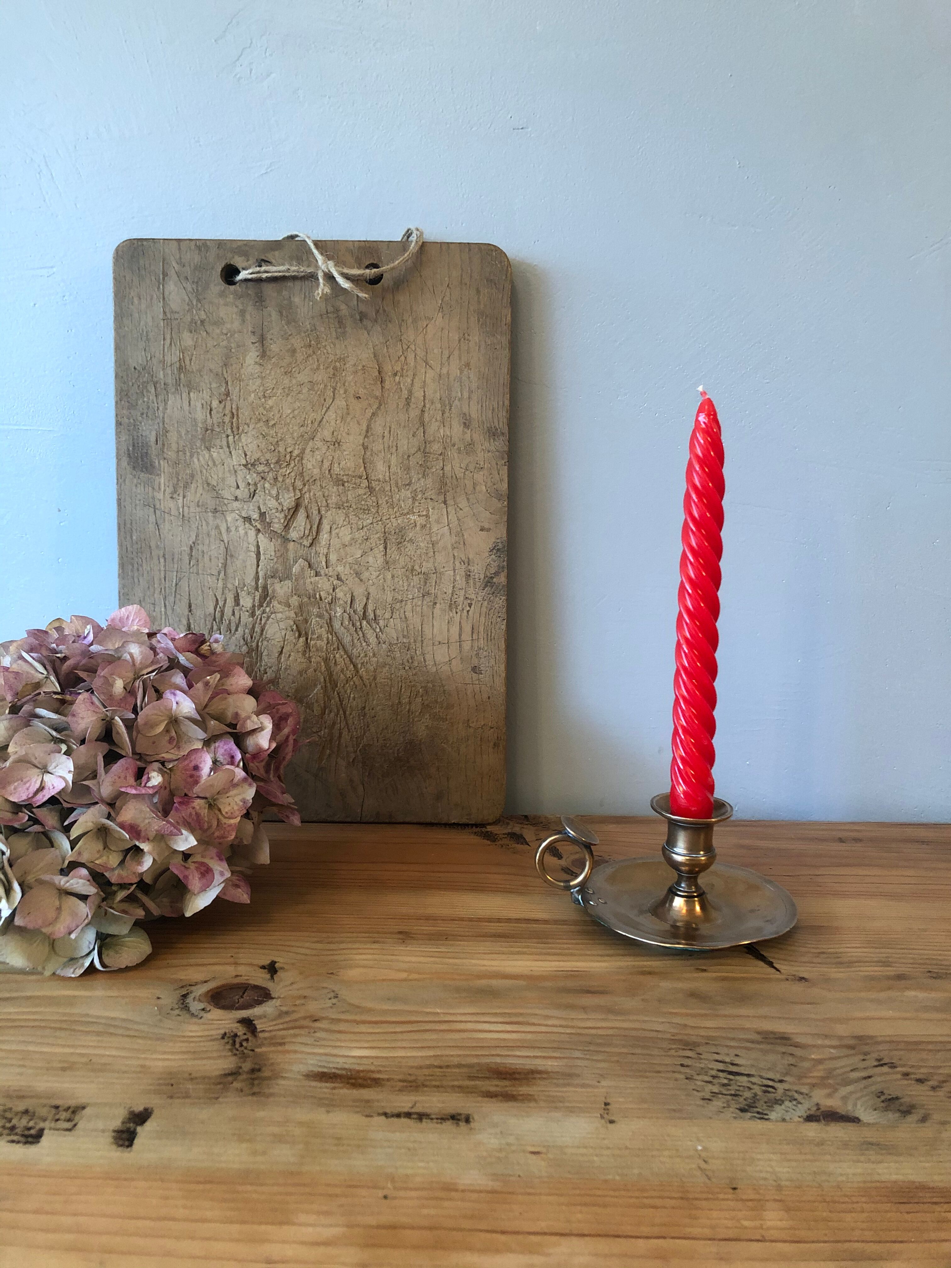 Old copper hand-held candlestick