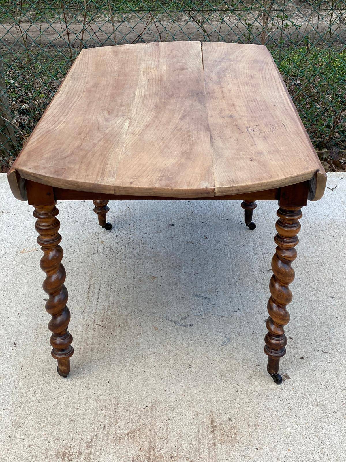 Louis Philippe oval table with shutters, 19th century, solid oak wood, twisted leg