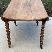 Louis Philippe oval table with shutters, 19th century, solid oak wood, twisted leg