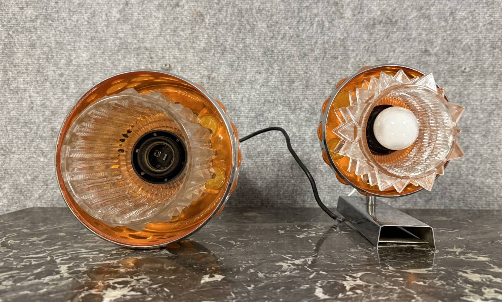 Two vintage space age pendant lamps by Raak, 1970