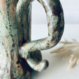 Old pitcher in glazed terracotta