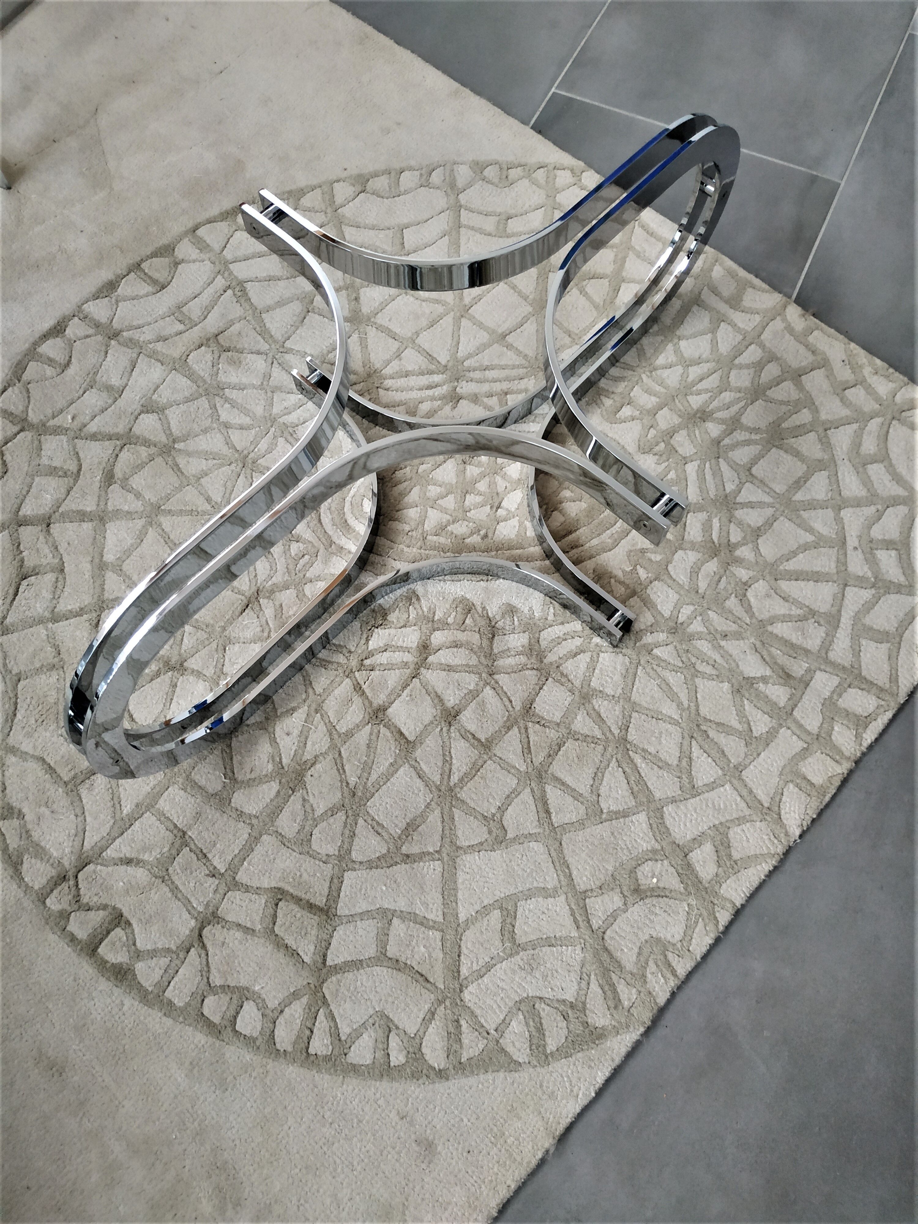 Chrome metal coffee table and oval smoked glass tray