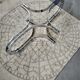 Chrome metal coffee table and oval smoked glass tray