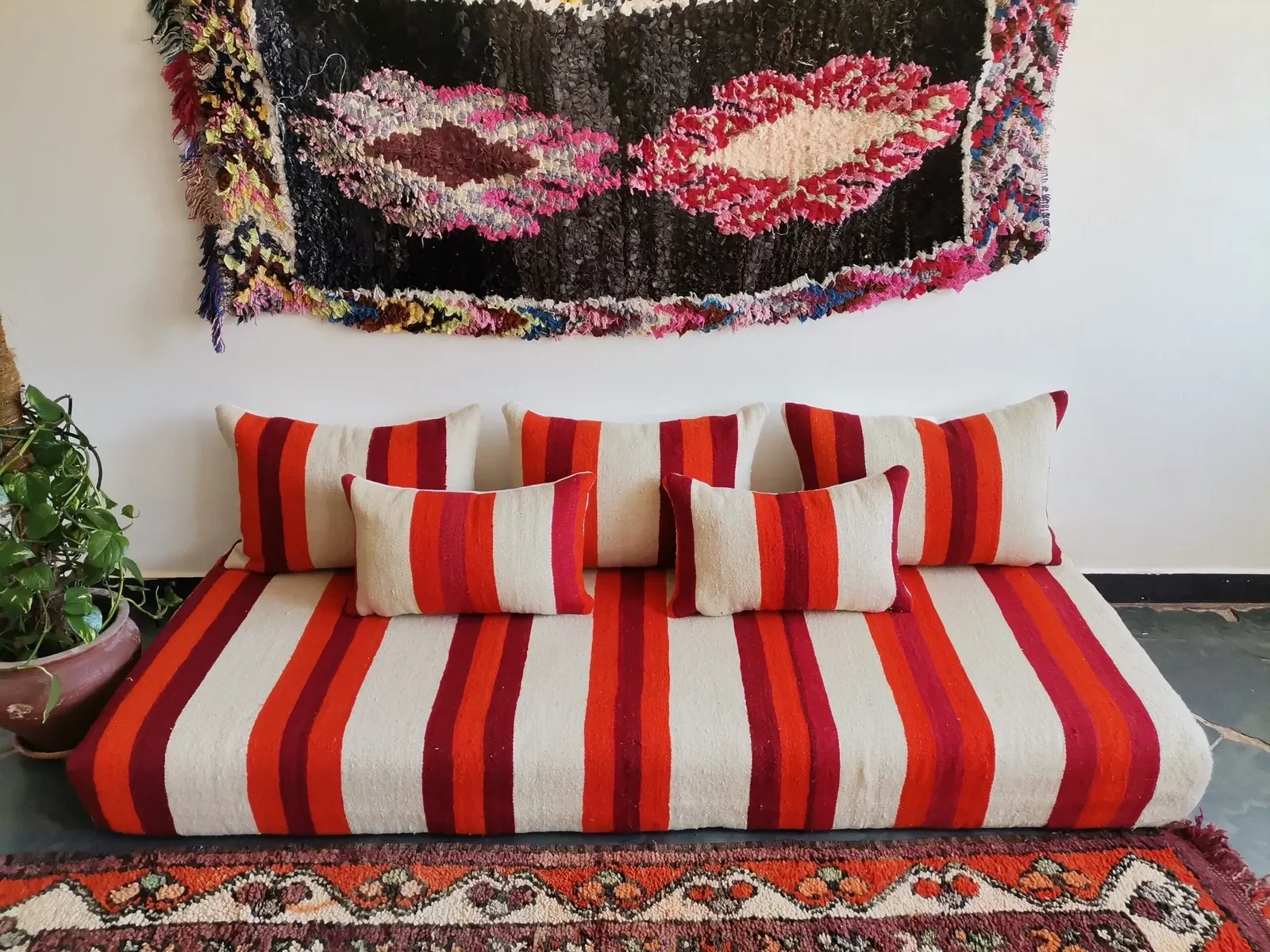Set of covers for cream and red Moroccan floor sofa.