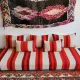 Set of covers for cream and red Moroccan floor sofa.