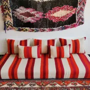 Set of covers for cream and red Moroccan floor sofa.