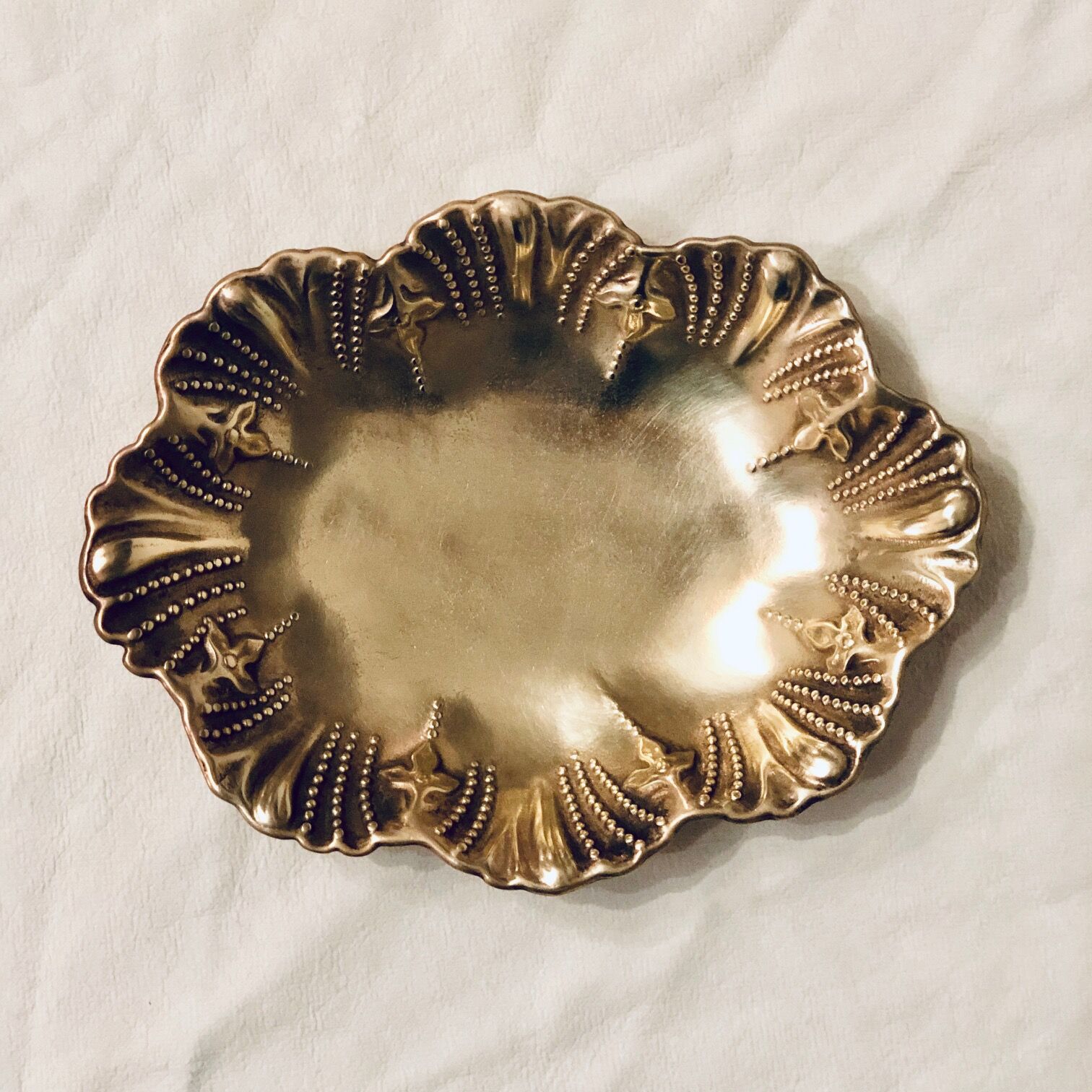 Empty oval brass pocket