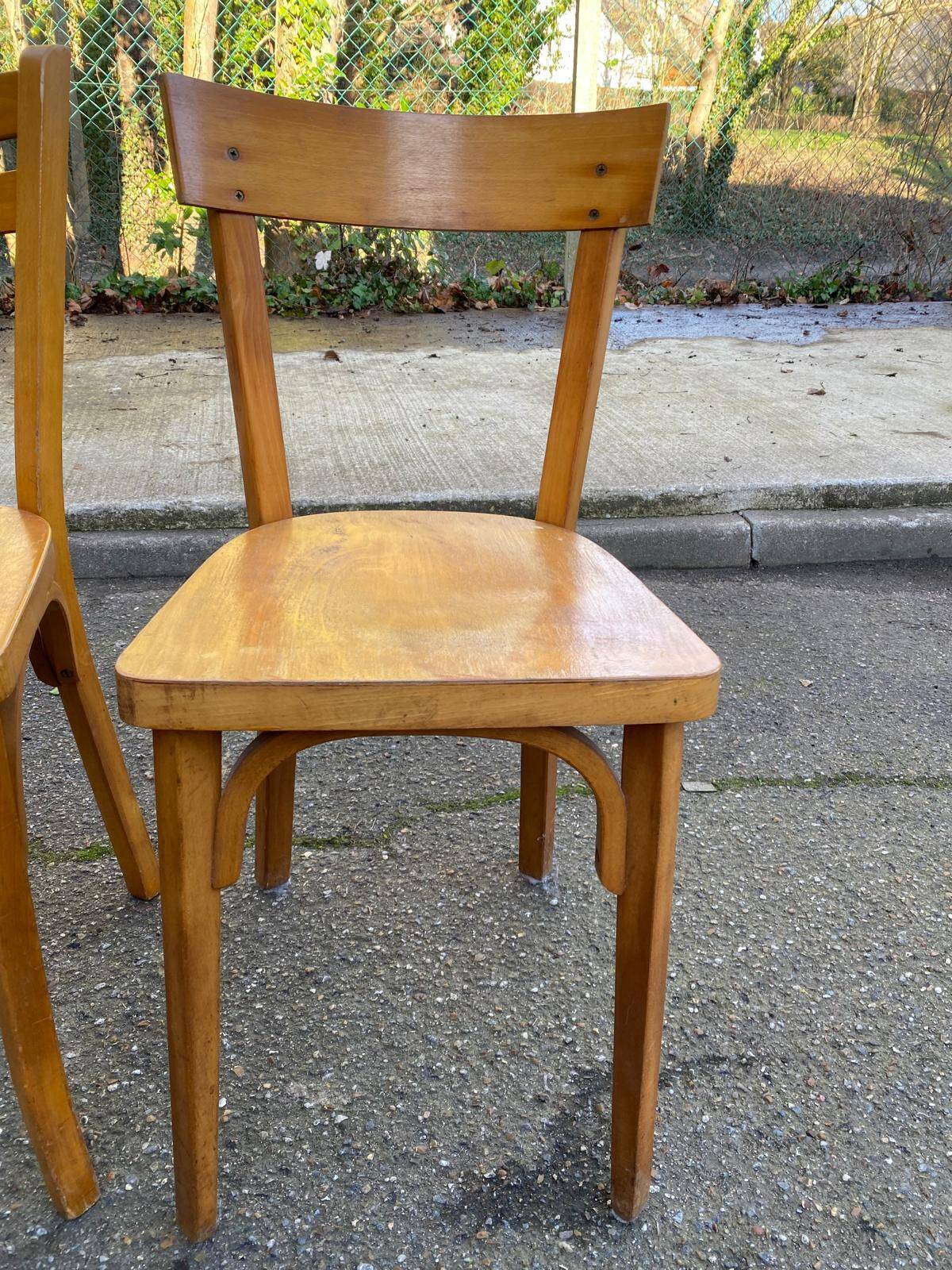 2 Scandinavian bistro chairs by Baumann in light wood from 1980.