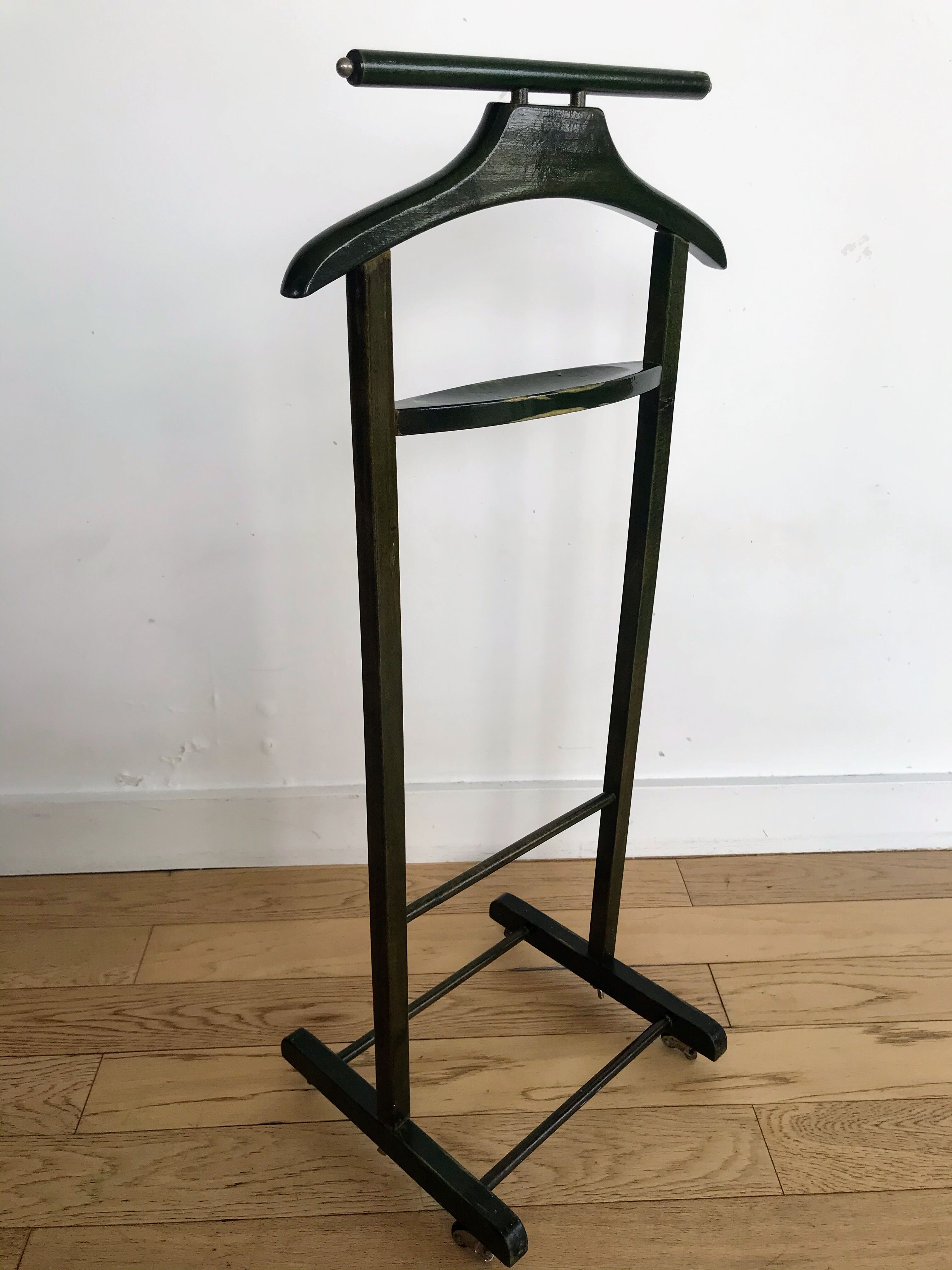 Vintage children's room valet in green varnished wood on roulette