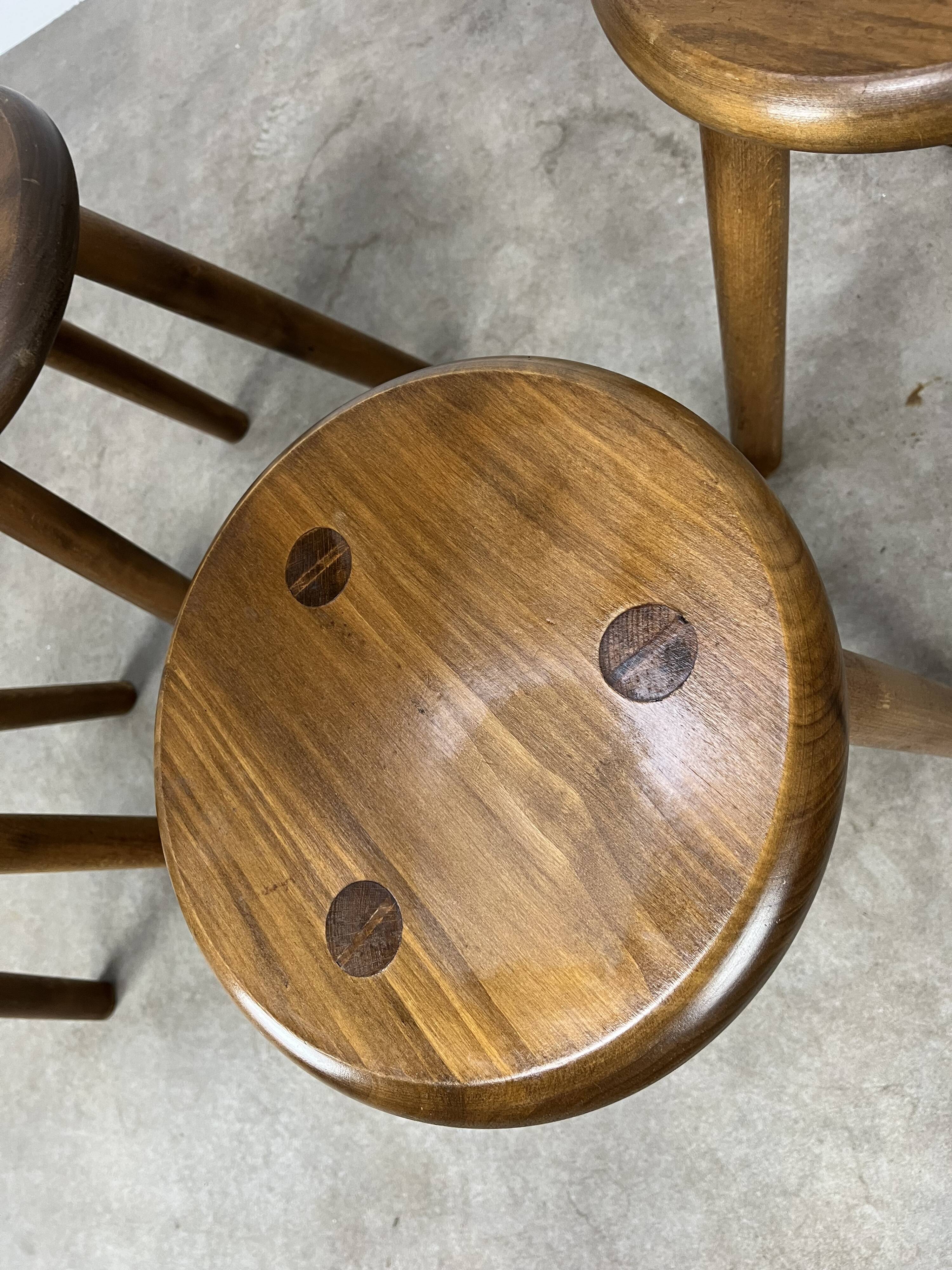 4 wooden tripod stools