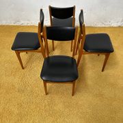 4 Scandinavian chairs in teak and black faux leather.