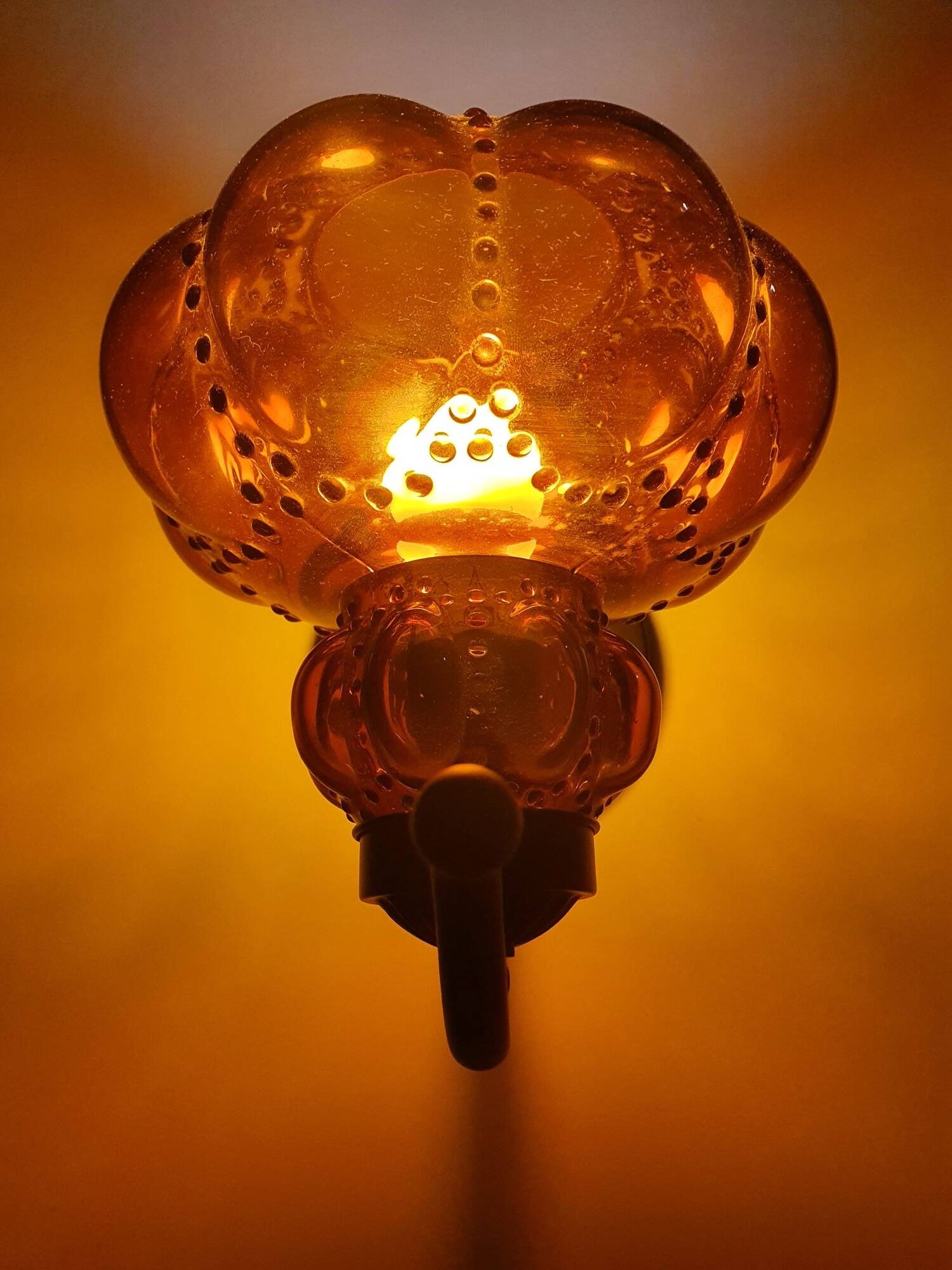 Three large vintage brown glass wall lights