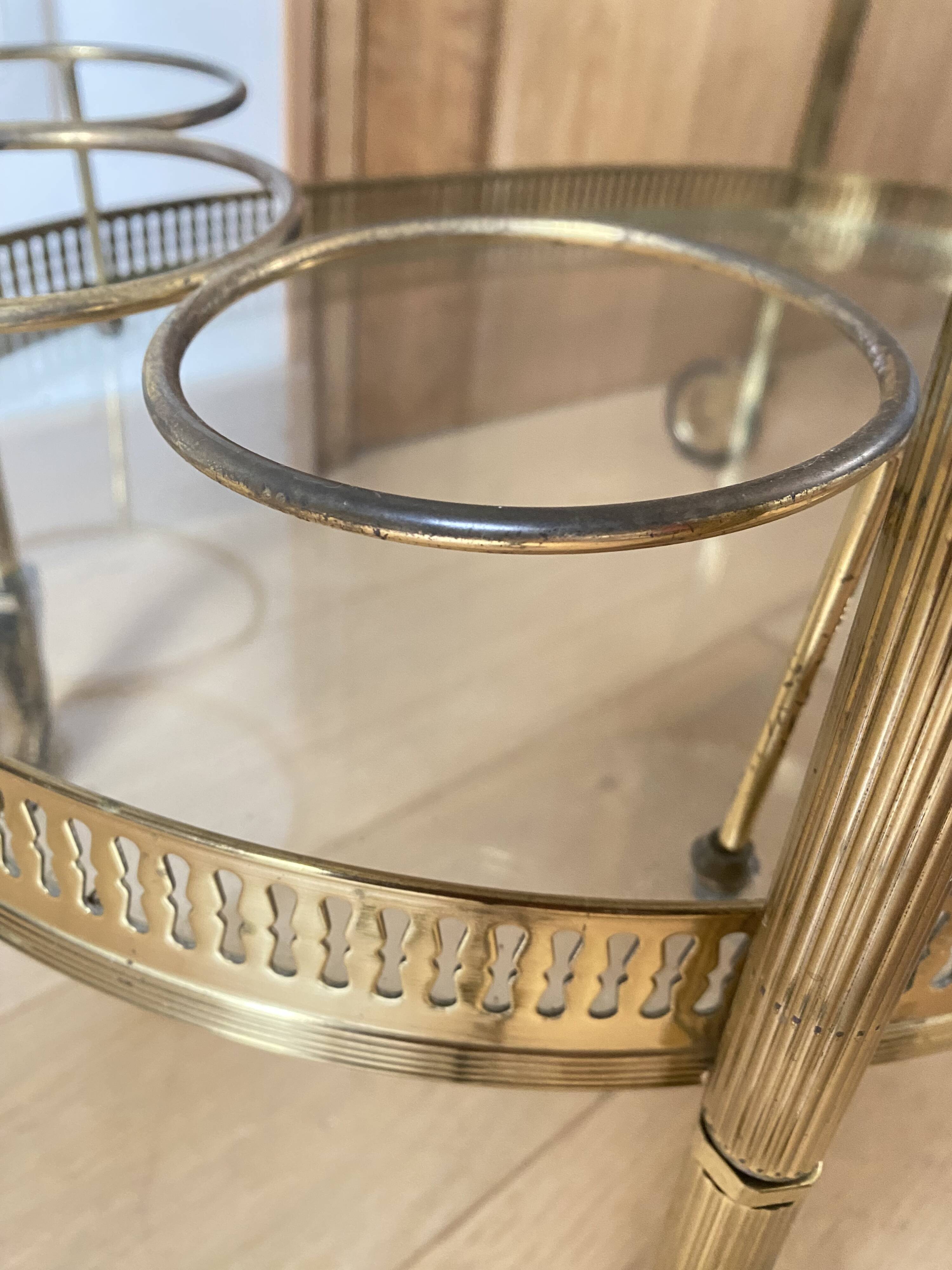 Oval golden brass rolling dessert trolley, Maison Jansen style, 1960s.