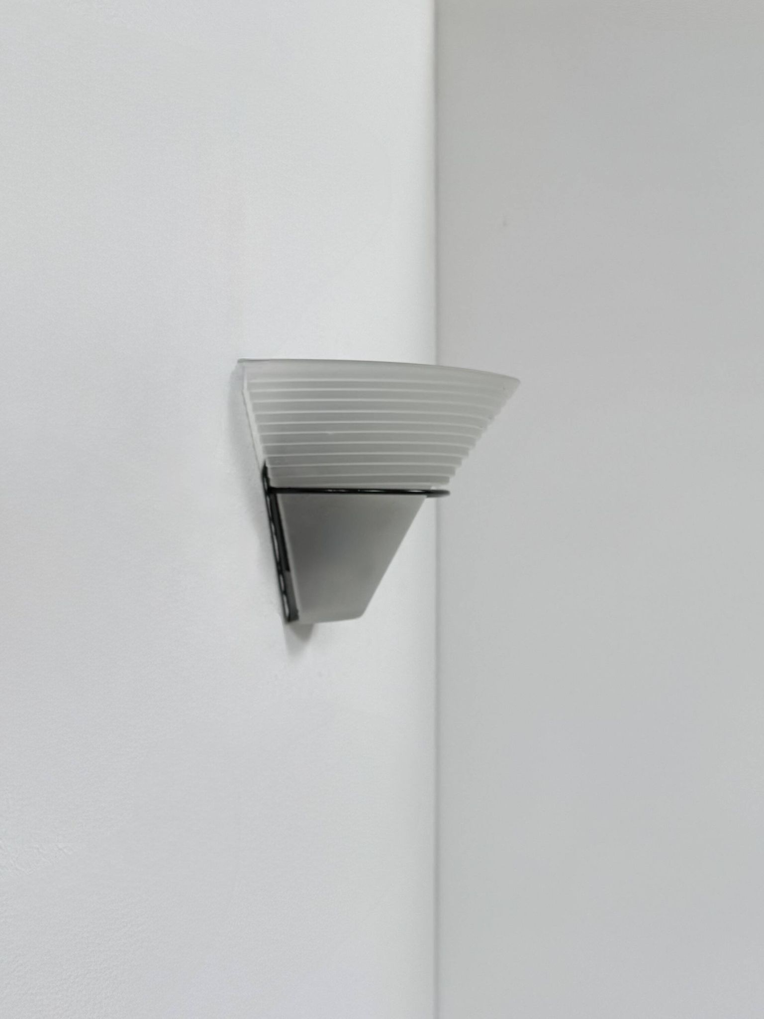 Frosted glass and black metal wall light, Italy, 1980.