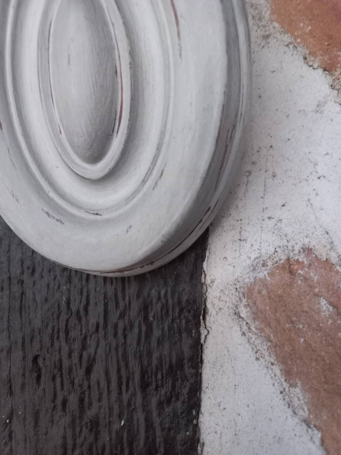 Pair of patinated oval woodwork