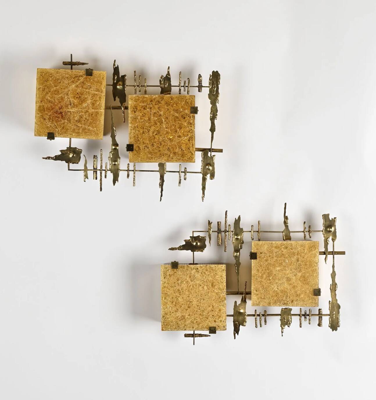 Pair of brutalist wall sconces in brass and fractal resin from the 1970s.