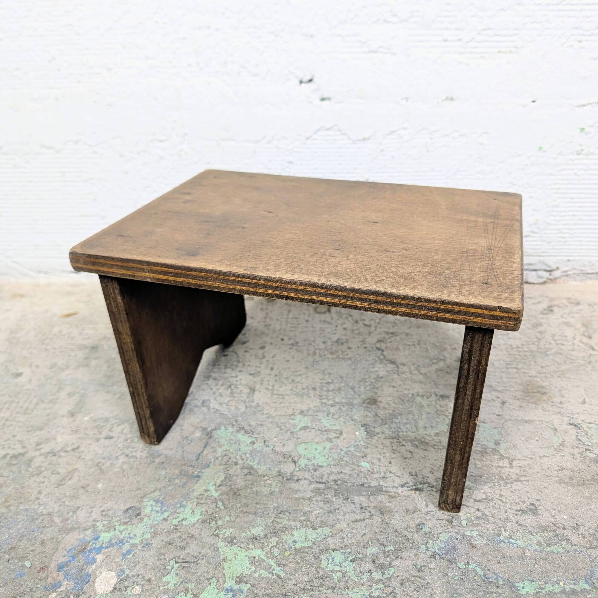 Small patinated wooden footrest bench