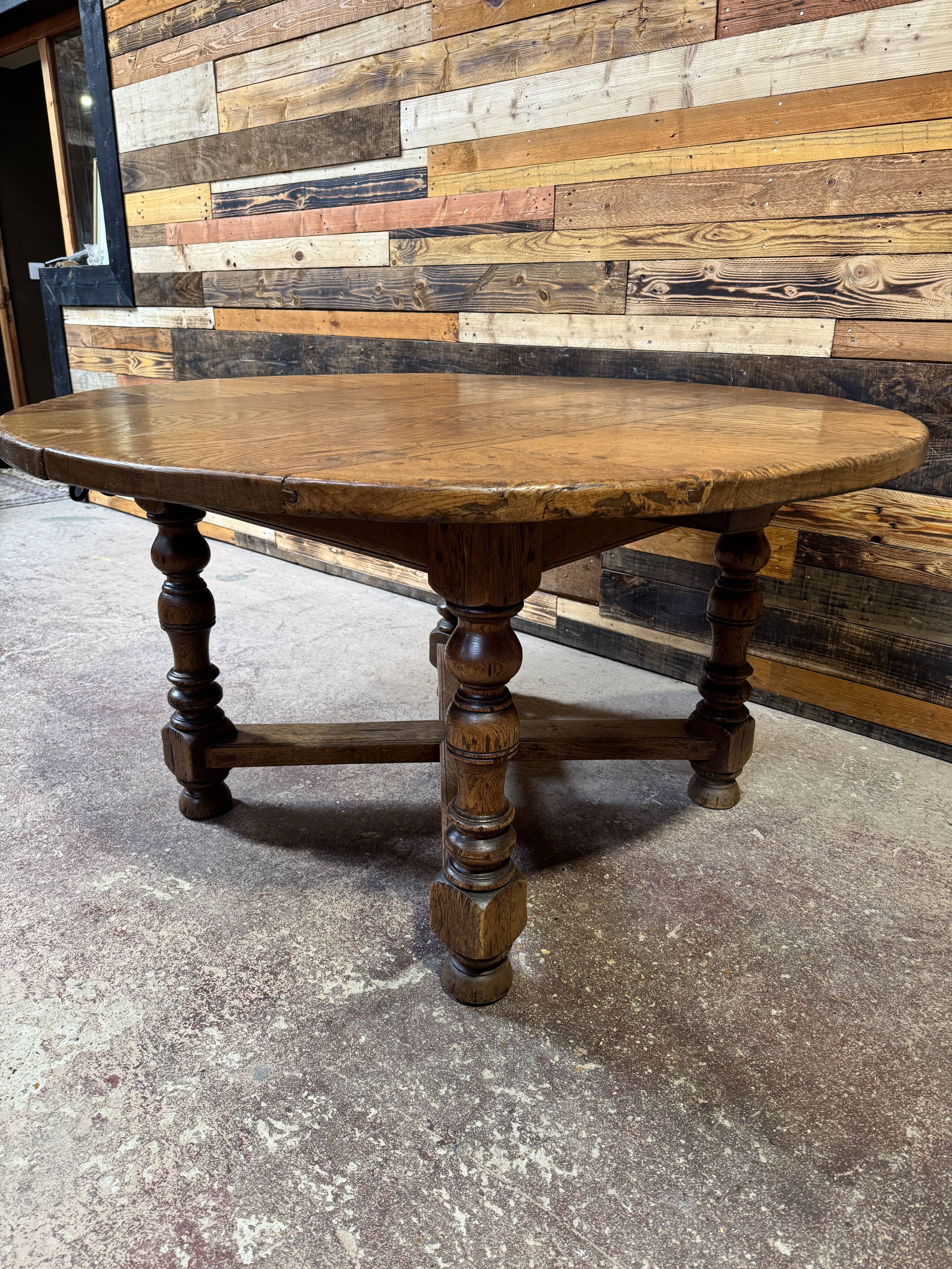 Antique oak round table with extensions, beautifully made from the years.