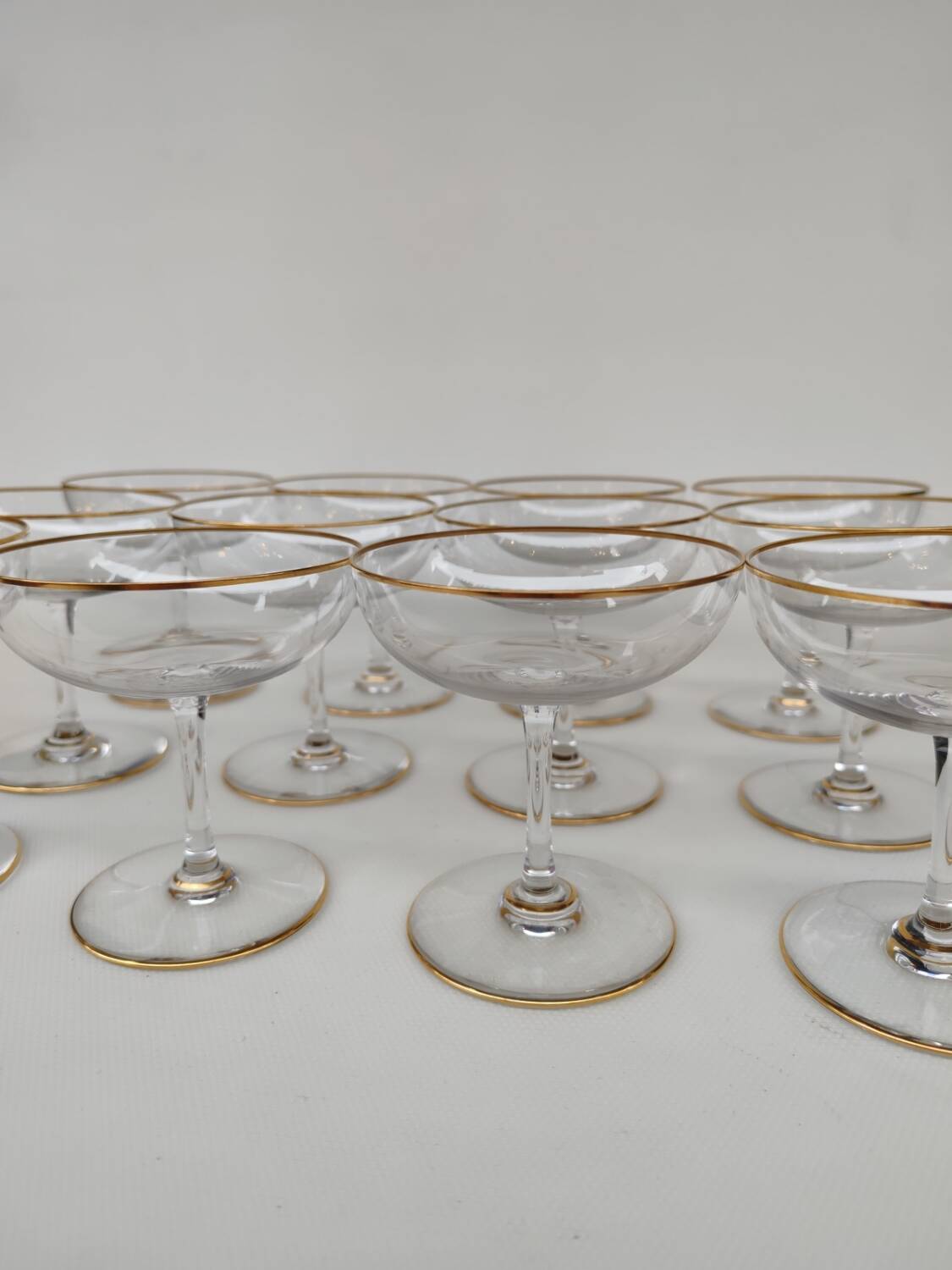 12 Baccarat crystal champagne coupes, circa 1900.
