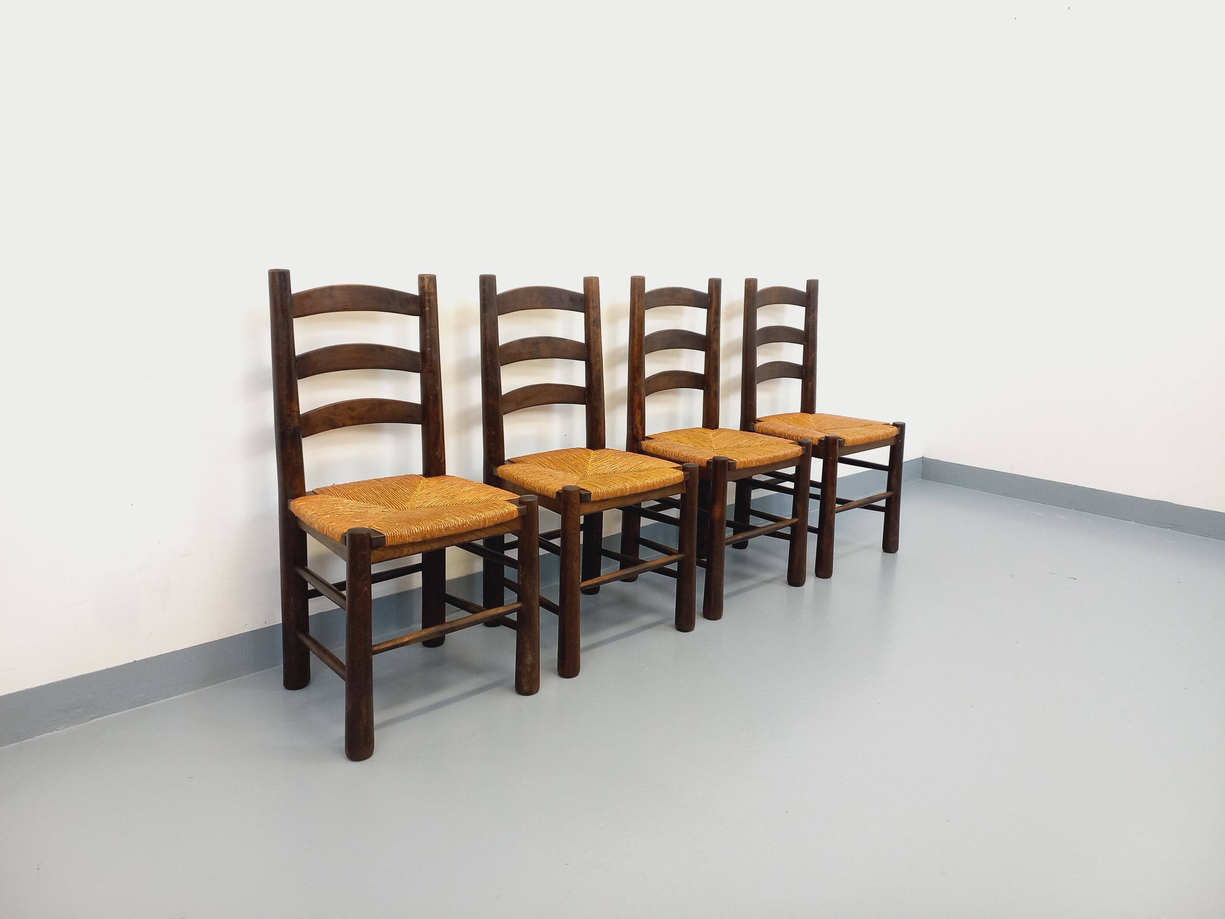 Set of 4 vintage brutalist chairs by Georges Robert in wood and straw.