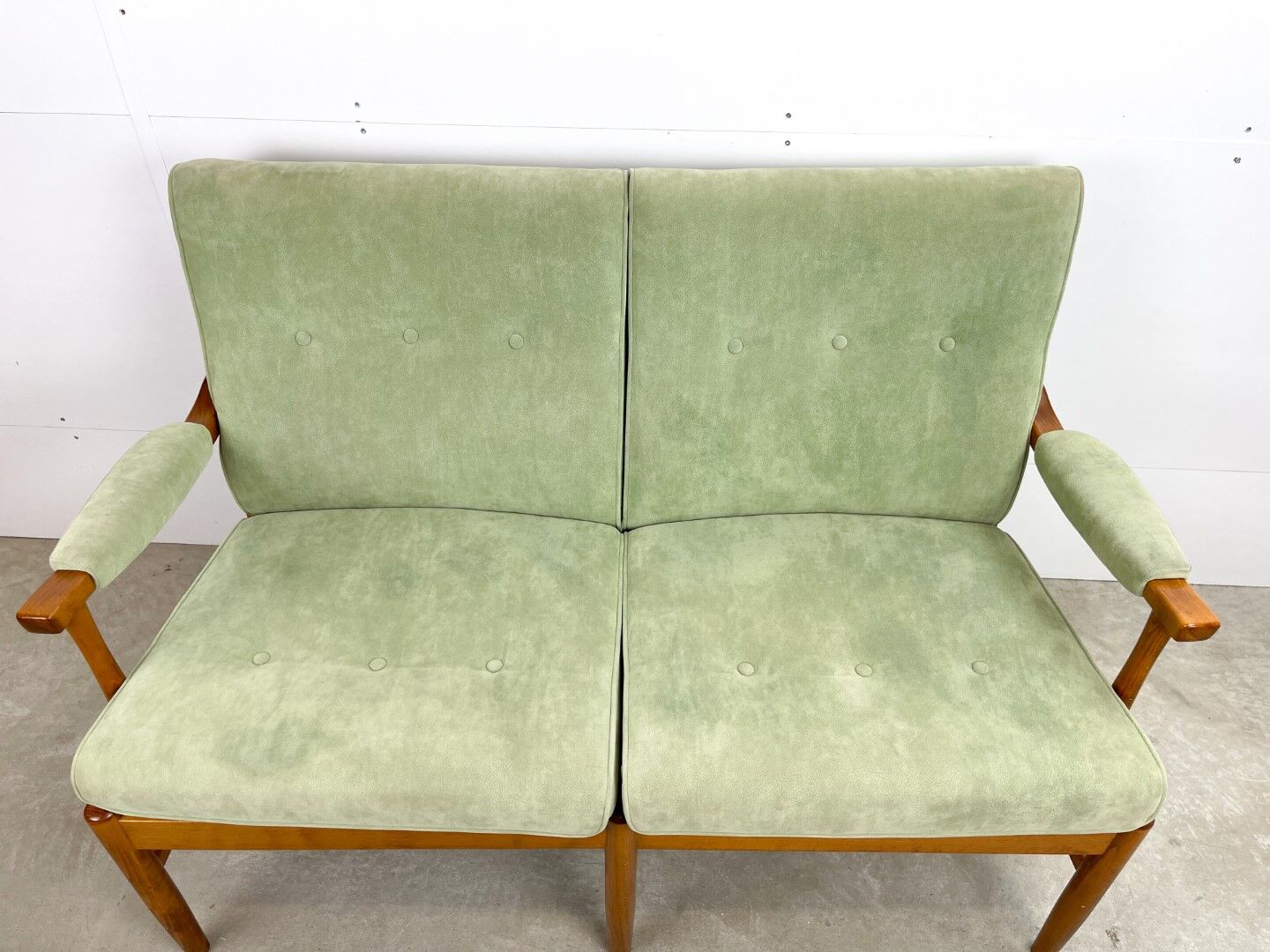 Two-seater sofa from the sixties with green upholstery
