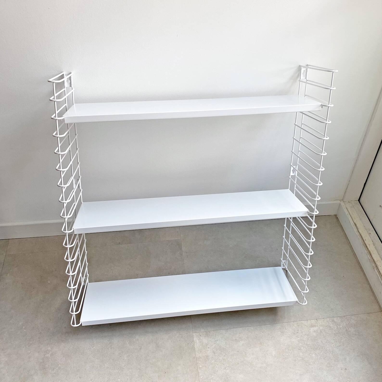 Tomado wall shelves designed by d. dekker for tomado