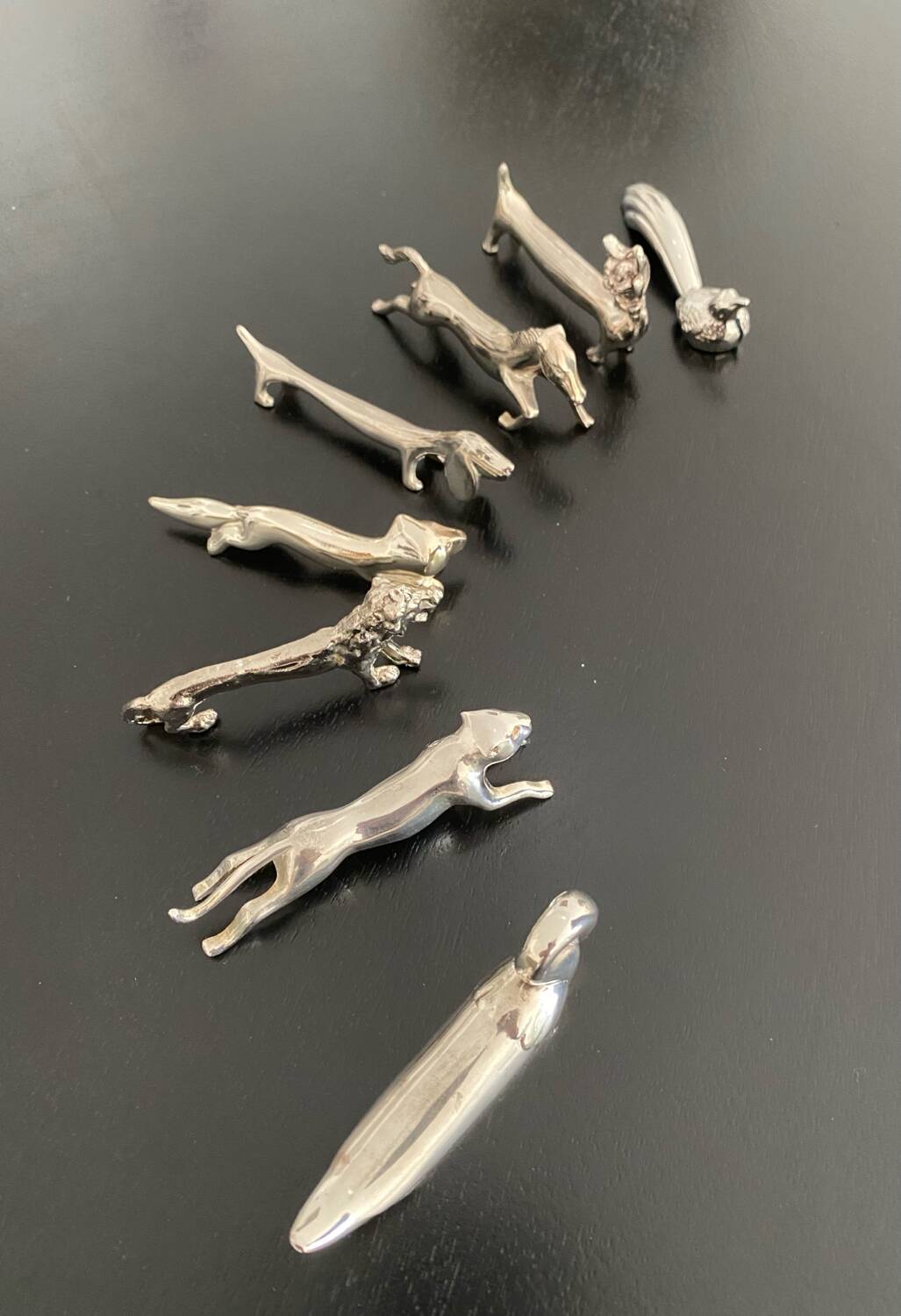8 various animal knife holders in silver-colored metal