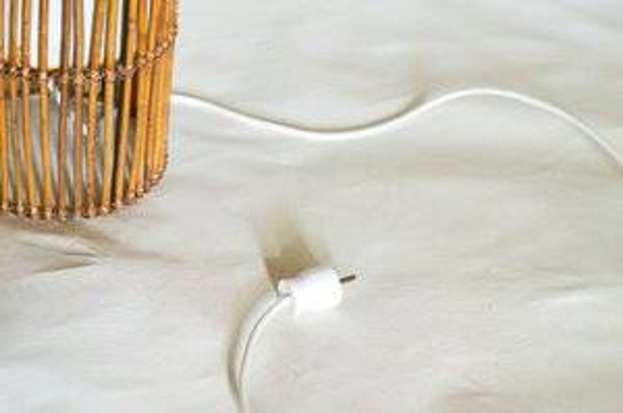 Mid-century rattan floor lamp, in the style of Louis Sognot.