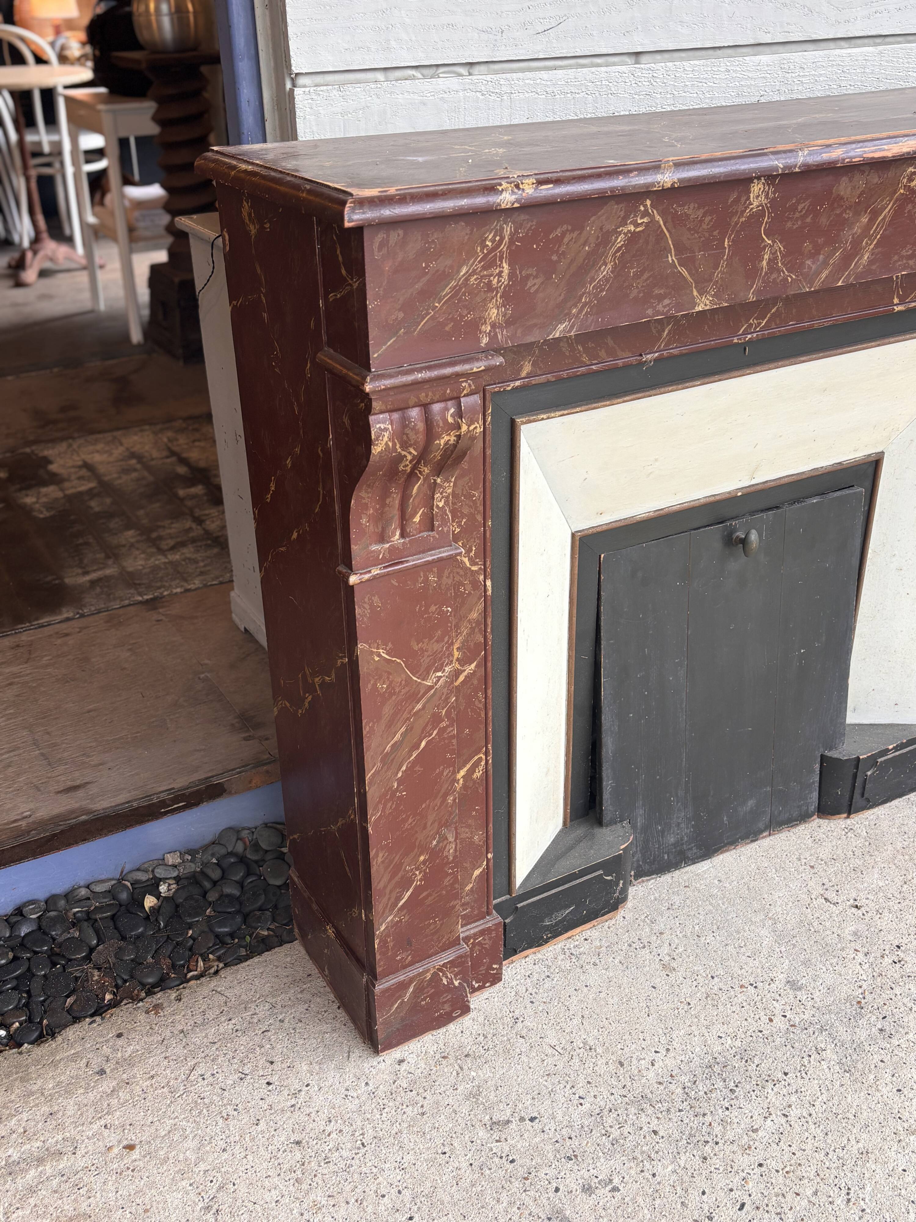 Wooden fireplace mantel imitating marble