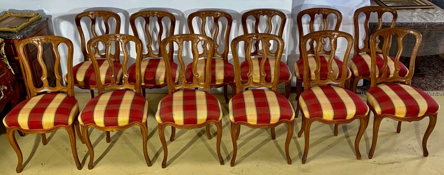 12 chairs in oak, carved wood with fleurette decorations, fabric seat