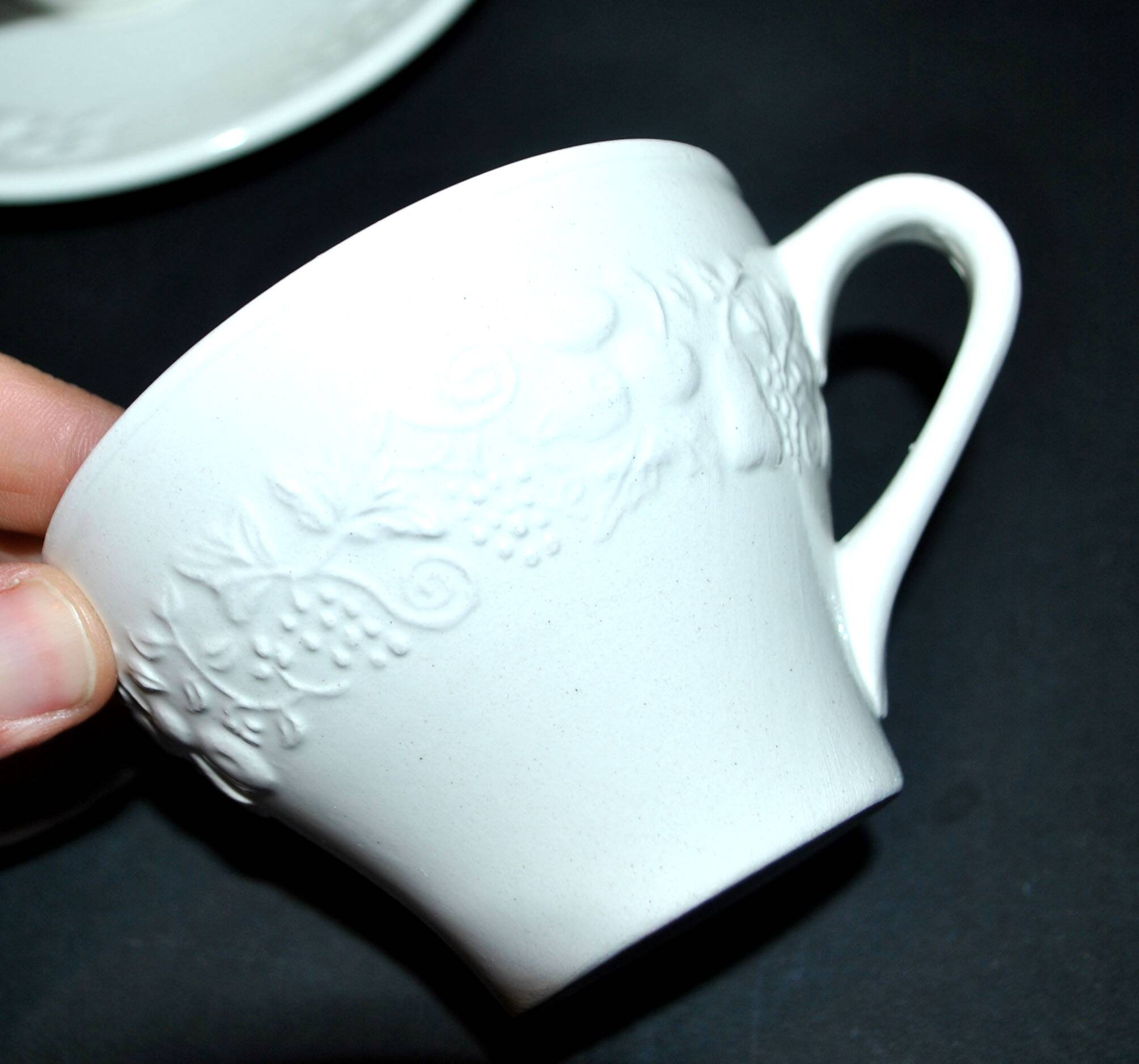 Set of 2 cups molded in opaque Sarreguemines earthenware