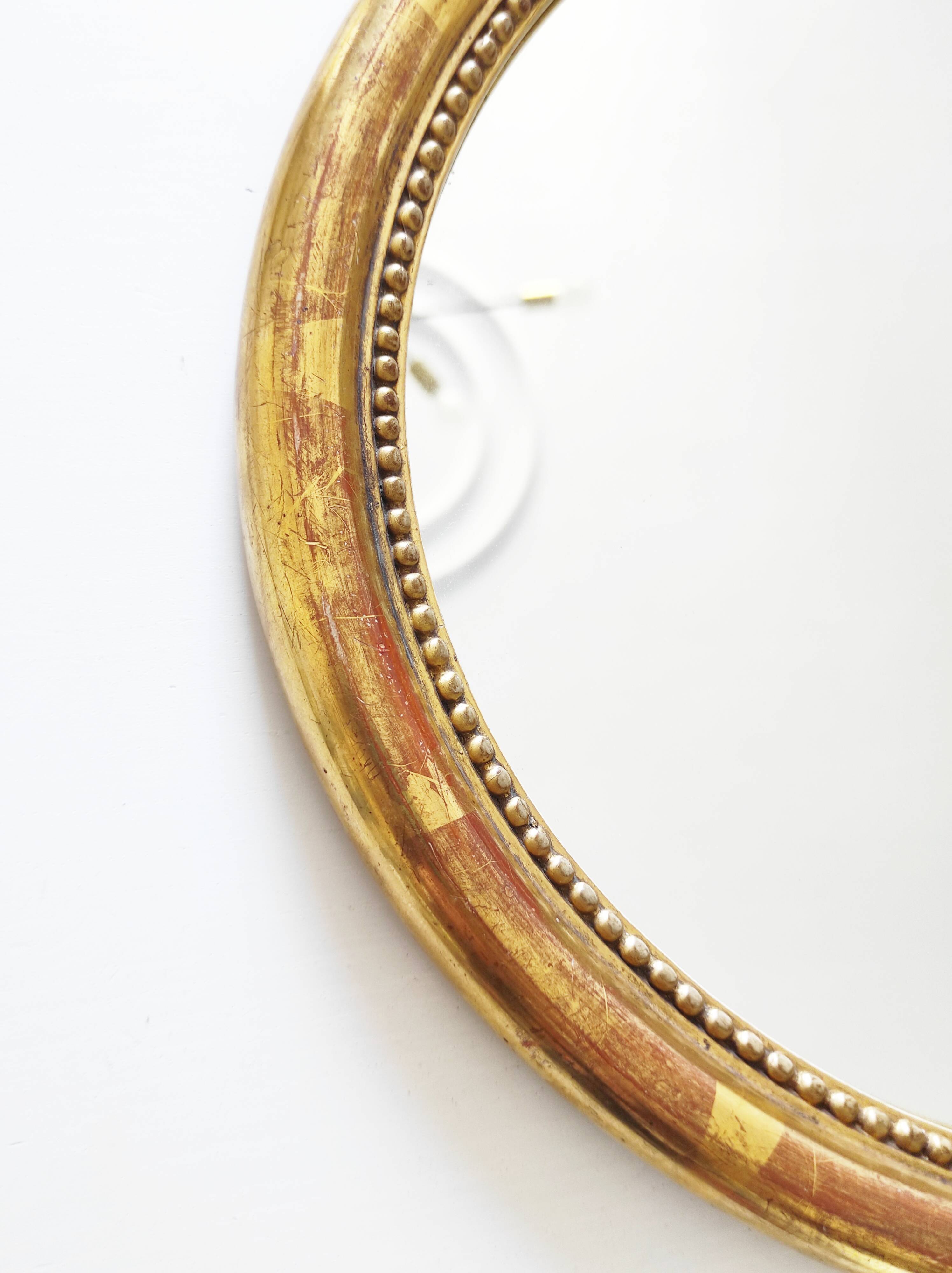 Miroir en bois doré avec fleurs