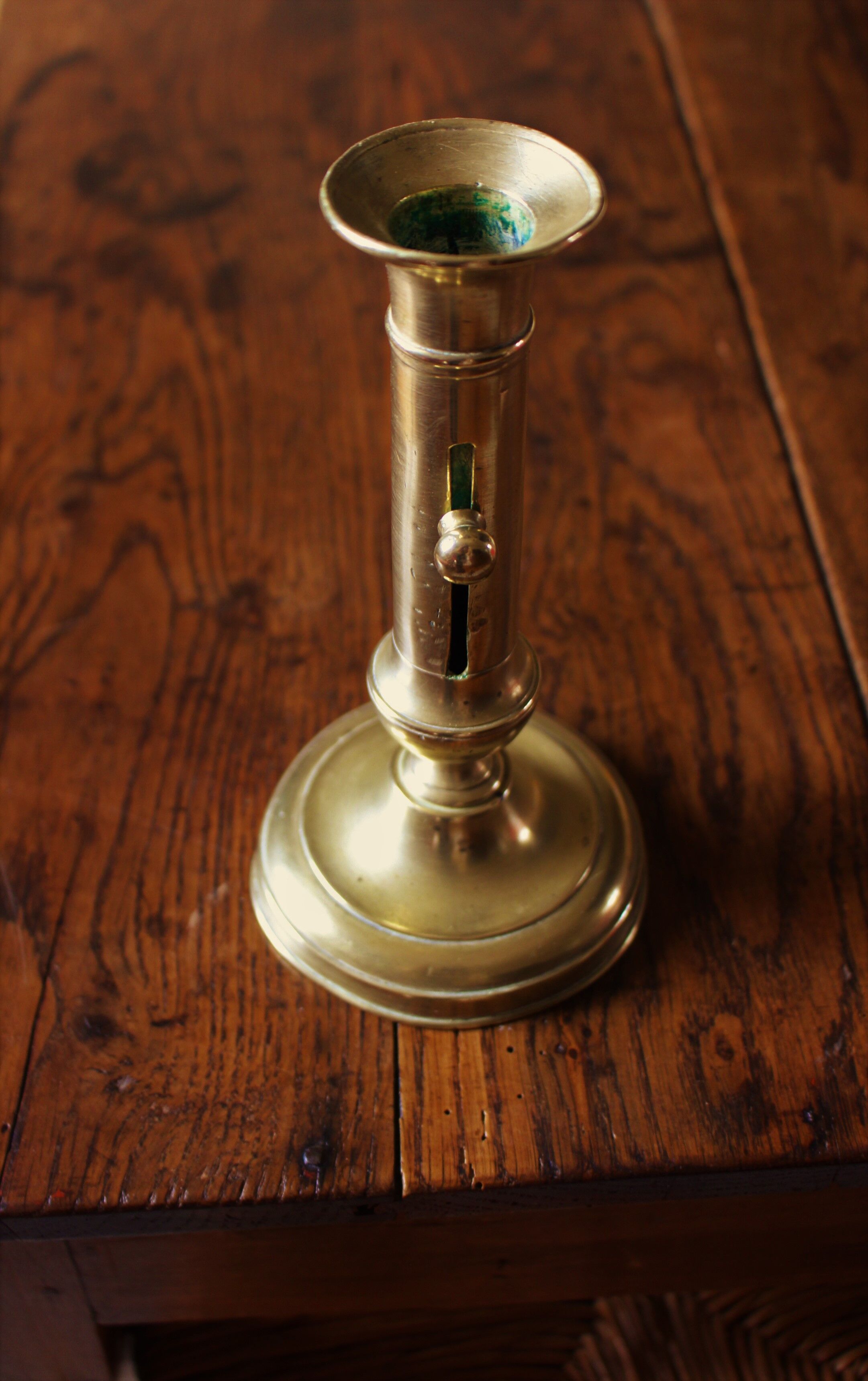 Brass pusher torch candle holder