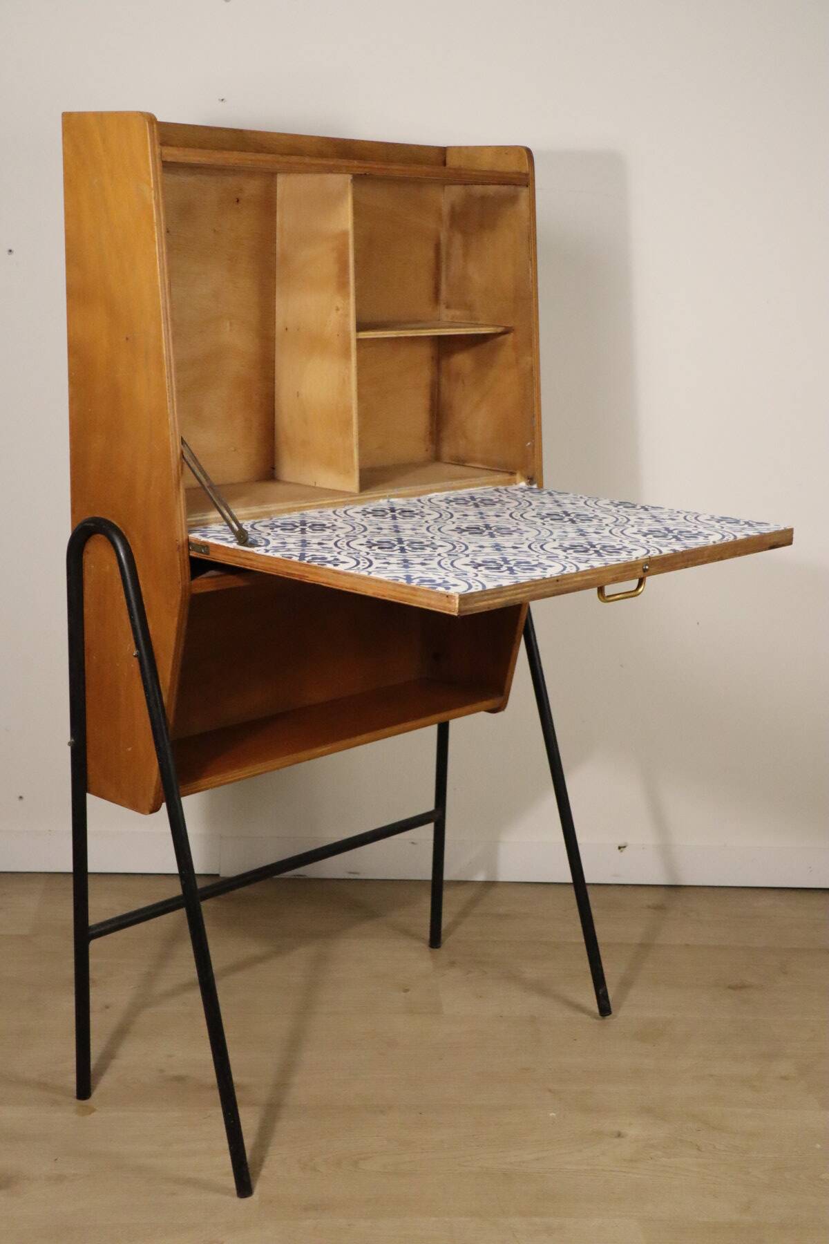Vintage 1960s wooden secretary with metal legs.