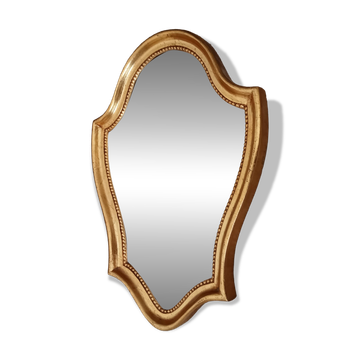 Vintage baroque mirror in gilded wood in the Louis XV style.