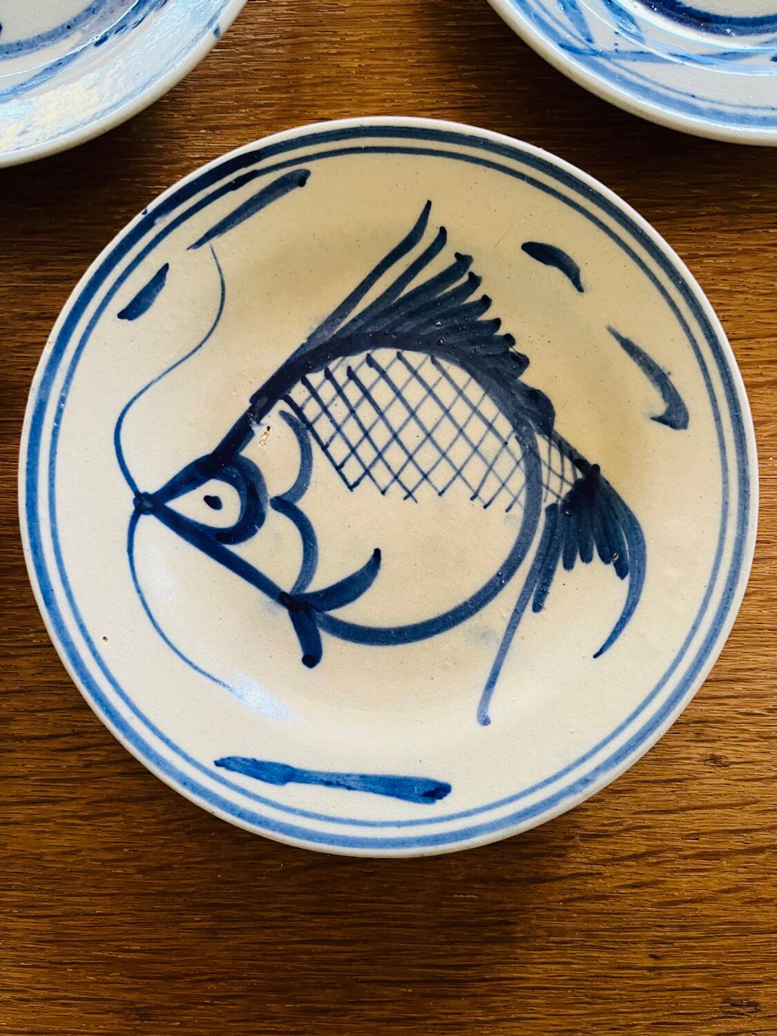 Earthenware plates with carp pattern