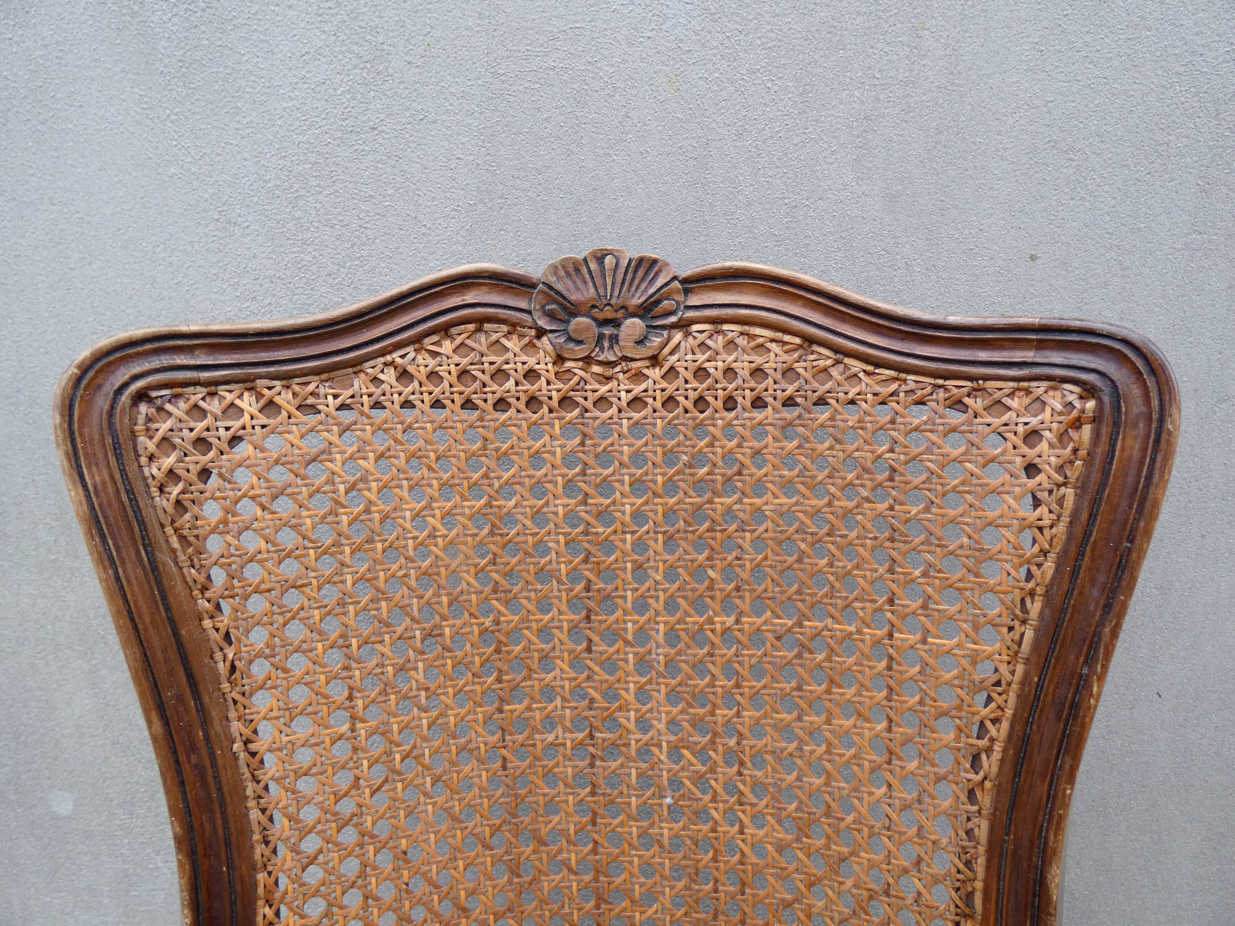 4 caned wooden chairs