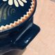 Alsatian pottery soup decorated with white flowers and green arabesques motifs