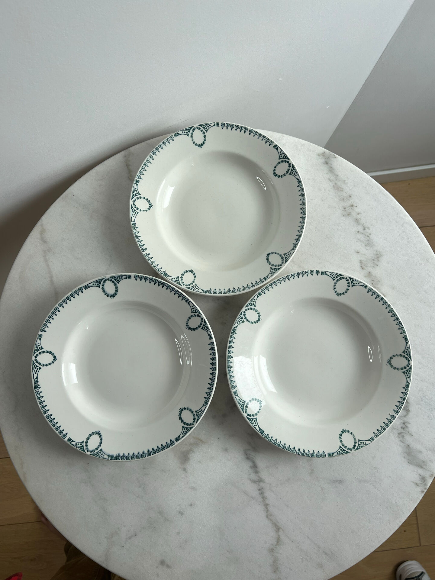 Set of 3 St Amand deep plates with green crown decoration.