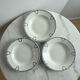 Set of 3 St Amand deep plates with green crown decoration.
