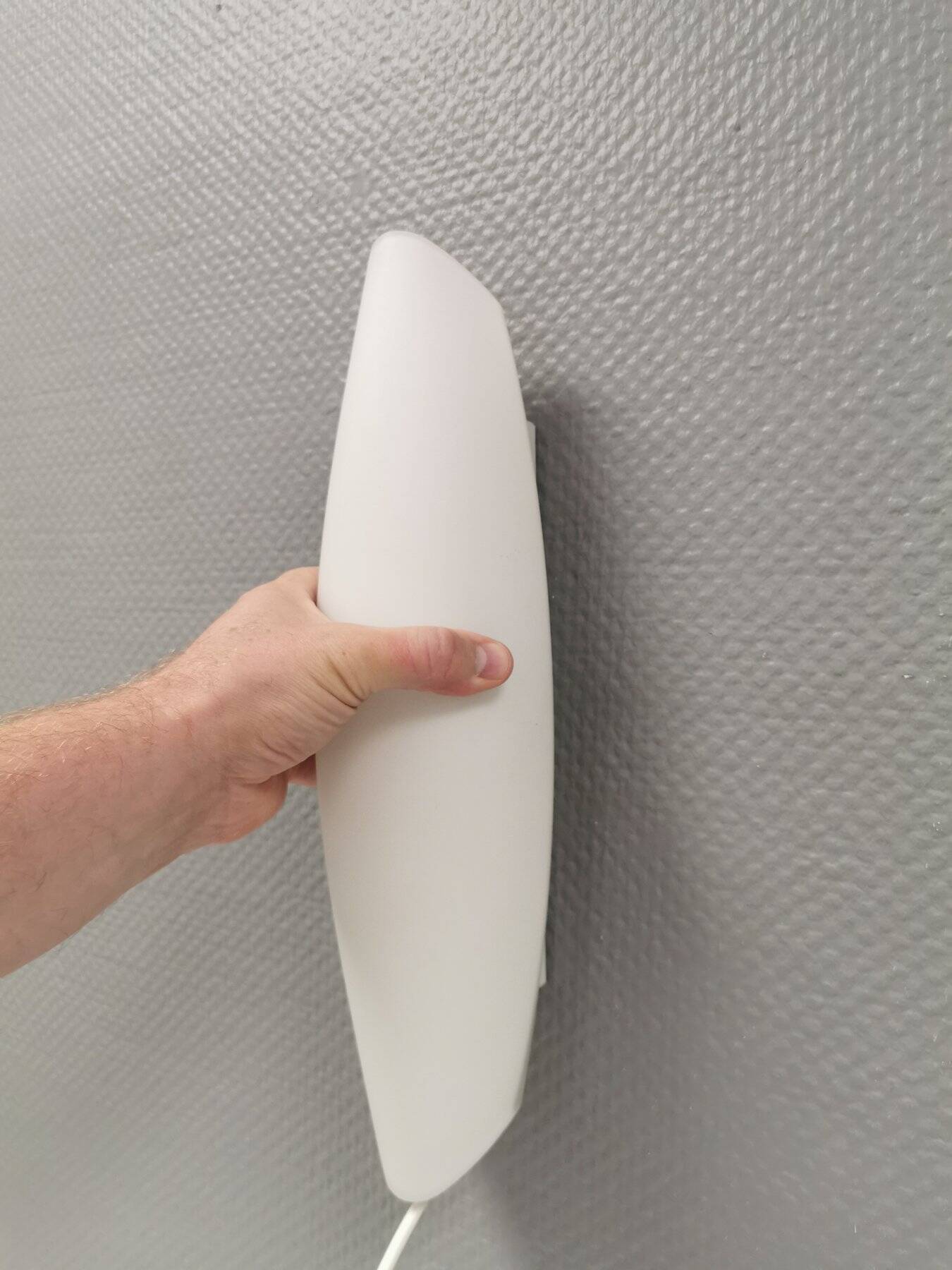 Wall lamp from Paulmann with white opal glass shade.