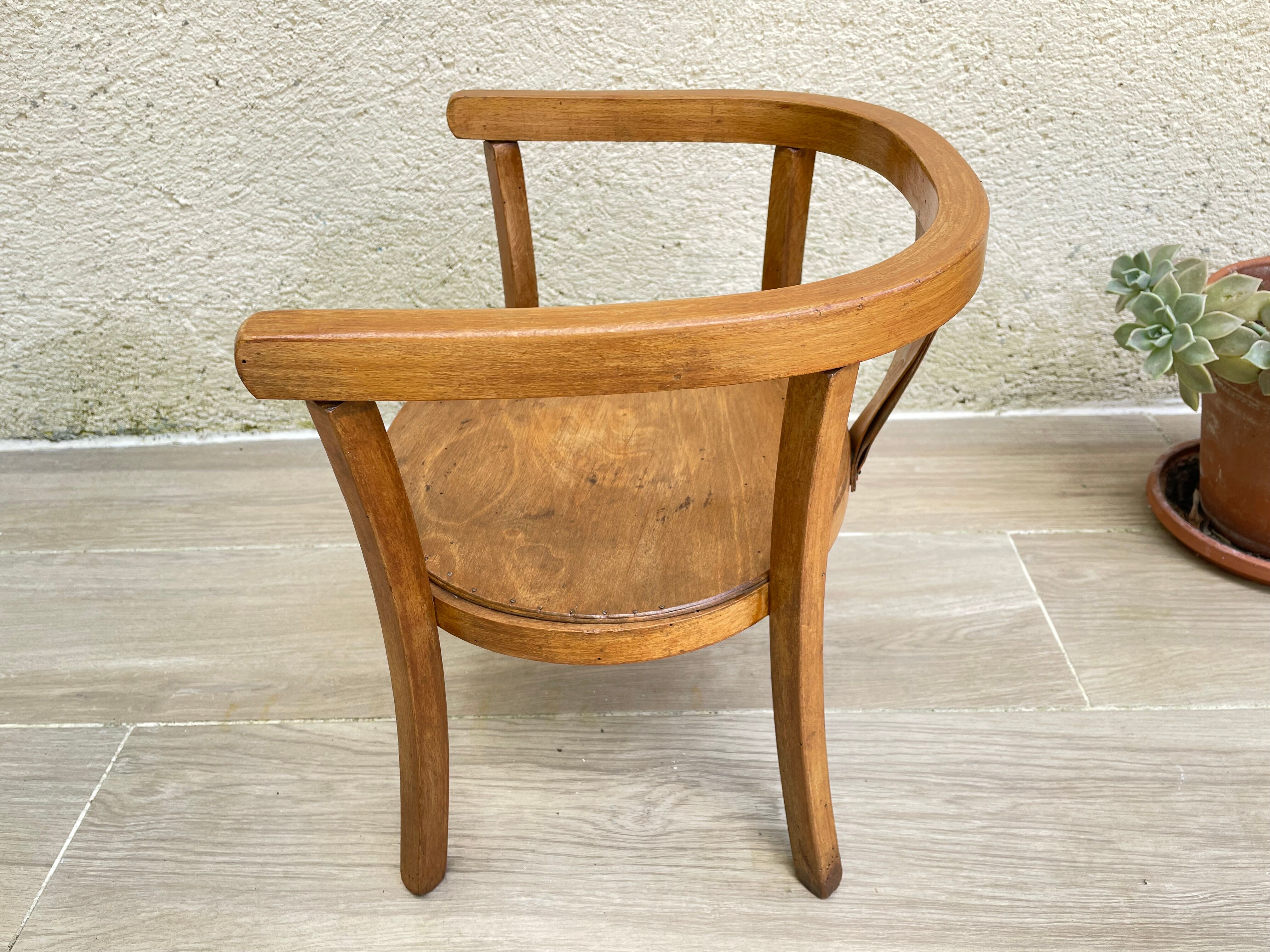 Old armchair for children in wood