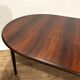 Extendable dining table in Rio rosewood.