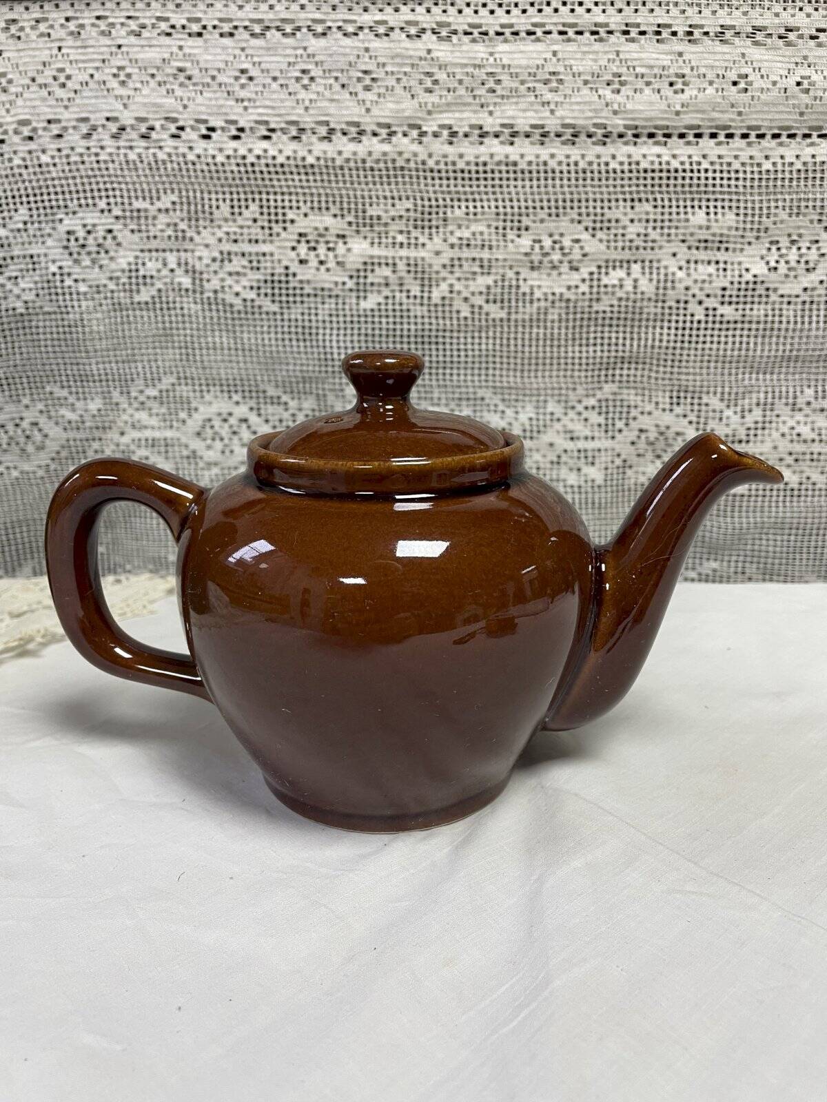 Brown glazed ceramic teapot