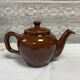 Brown glazed ceramic teapot