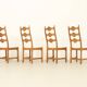 Four oak dining chairs by Henning Kjaernulf.