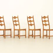 Four oak dining chairs by Henning Kjaernulf.