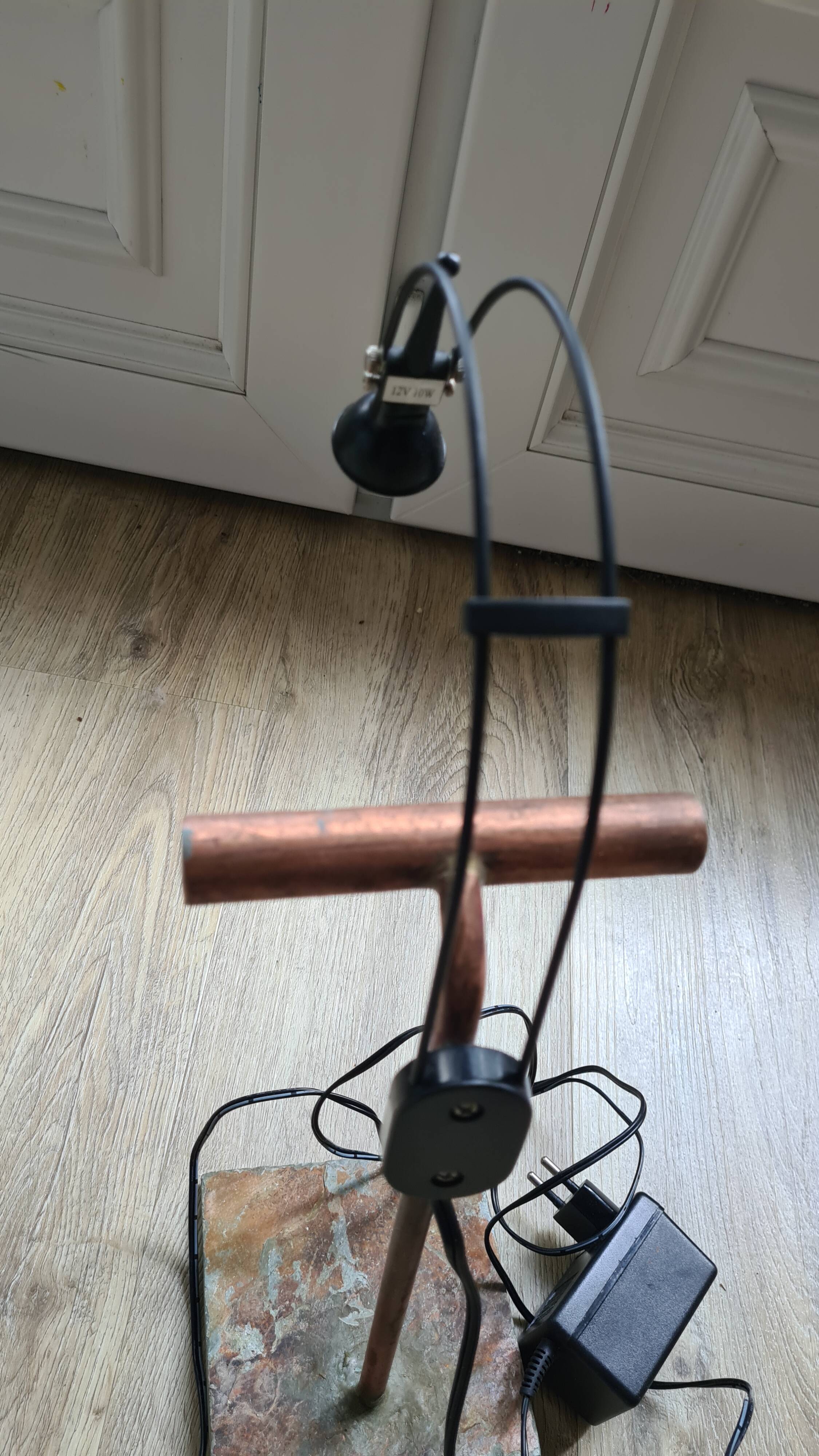 old lamp with stone base and copper arm