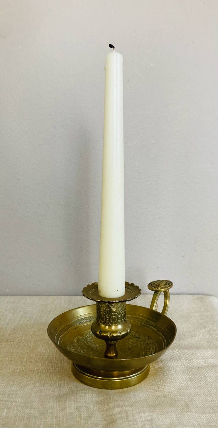 20th century chiseled brass socket candle holder representing Horsemen in armor