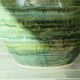 Glazed ceramic ball lamp base, green gradients.